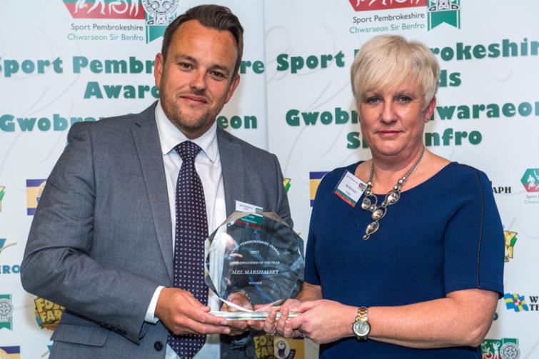 Mel receiving her Sport Pembrokeshire award from Mark Lester